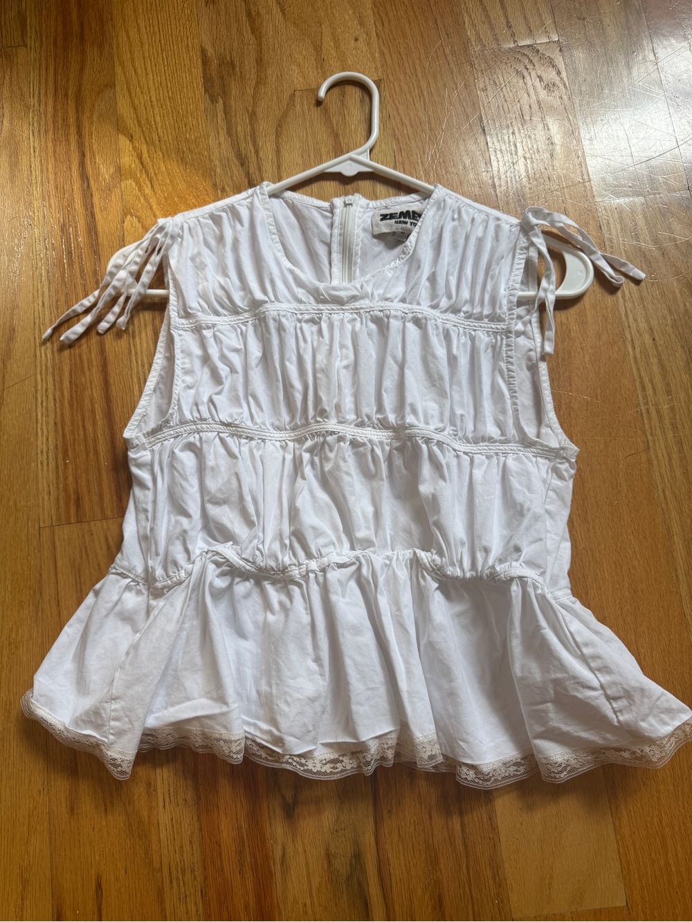 Zemeta White Ruffled Sleeveless Peplum Top Medium